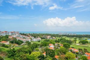 an aerial view of a city with houses and the ocean at Ocean View 4Bd Penthouse Wyndham Spectacular View near El Yunque Forest in Rio Grande