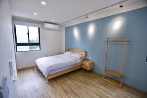 Letto o letti in una camera di 青逸居 桃園中壢民宿 親子包棟 Qing Yi Ju