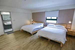 Letto o letti in una camera di 青逸居 桃園中壢民宿 親子包棟 Qing Yi Ju