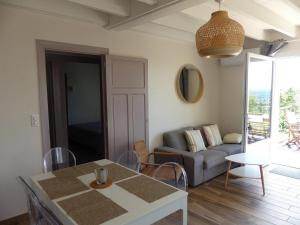 a living room with a couch and a table at Gîte Abrest, 5 pièces, 8 personnes - FR-1-489-386 in Abrest