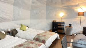 Postel nebo postele na pokoji v ubytování YUKARA Glamping 北海道大沼公園