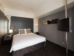 TV a/nebo společenská místnost v ubytování Kyoto Brighton Hotel