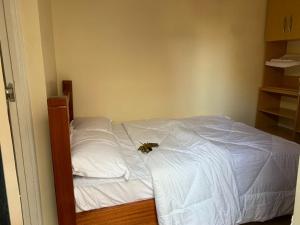 a bed with a bee sitting on top of it at 3 bedroom maisonette in Kitengela, Nairobi in Kitengela 