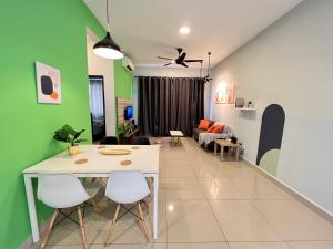 a living room with a white table and chairs at RiverView 8PAX 2BR in KBtown PS4, Netflix A-1-12 in Kota Bharu