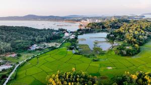an aerial view of a river and a city at Coto Island Beach Village Homestay in Dao Co To
