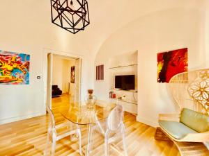 a dining room with a glass table and chairs at Borgo Virginia - Sea View in Amalfi Coast in Vietri sul Mare