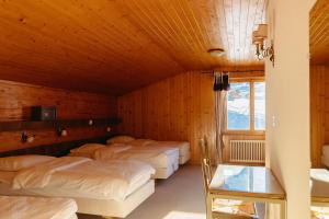 Ένα ή περισσότερα κρεβάτια σε δωμάτιο στο Camp Suisse @ The Télécabine