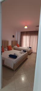 a bedroom with two beds in a room at Villa Nefeli Prive in Ksamil