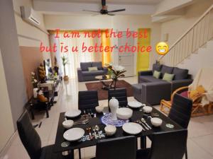 a living room with a table and a dining room at #Semenyih #cozy #BBQ in Semenyih