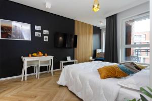 Postel nebo postele na pokoji v ubytování AVRA Residence II Stare Miasto + 14 fotografií