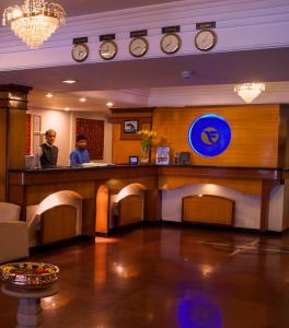 a bar in a hotel with a man standing at a counter at Fortune Park Galaxy, Vapi - Member ITC Hotels' Group in Vapi