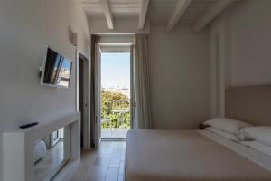a bedroom with a bed and a window with a view at Tra Cielo e Mare in Vieste