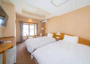 Postel nebo postele na pokoji v ubytování Saka no Hotel Tretio Ochanomizu