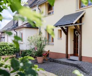 a house with a solarium on the side of it at 2 Bett Ferienwohnung Rose in Westerburg +9 photos