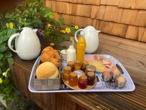 a tray with food and drinks on a table at Entre mare et chêne in Frasnes-lez-Anvaing