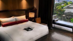 Rúm í herbergi á Grand View Resort Beitou