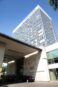 a building with a car parked in front of it at InterContinental Genève by IHG in Geneva