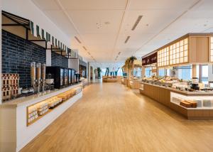 a grocery store with a long aisle with food at The Archipelago in Toucheng