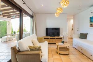 TV a/nebo společenská místnost v ubytování Resort Villa Luny Gandia