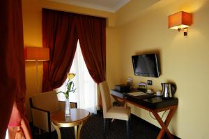 TV o dispositivi per l'intrattenimento presso Bram Hotel