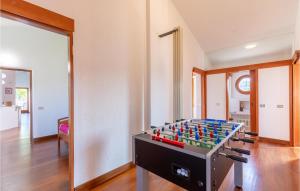 a room with a foosball table in the middle at Gorgeous Home In Montegabbione Tr With Kitchen in Montegabbione