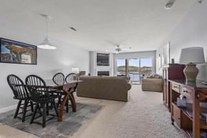 a living room with a table and chairs and a couch at Quietside in Camdenton