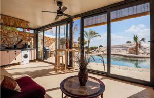 a living room with a vase on a table at House Near Golf Course in Murcia