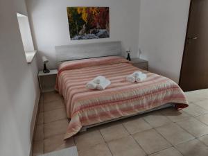 Tempat tidur dalam kamar di Il BORGOIN