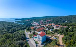 an aerial view of a small village on a hill with water at Villa Rozeta in Marčana