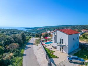 an aerial view of a house with a car on a road at Villa Rozeta in Marčana