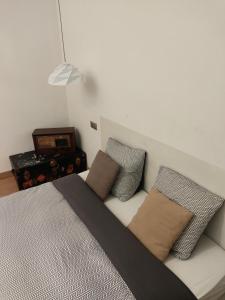 a bedroom with a bed with two pillows on it at Beautiful family flat nearby the Flea Market, Stade de France, Montmartre in Saint-Ouen