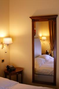 Letto o letti in una camera di Bram Hotel