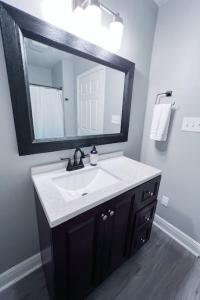 a bathroom with a sink and a mirror at Serenity Springs in Hot Springs +25 photos