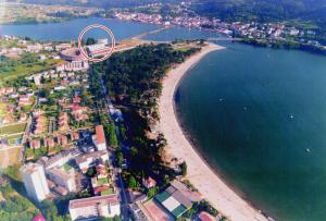 an aerial view of a beach next to a body of water at Hotel Sarga in Cabañas