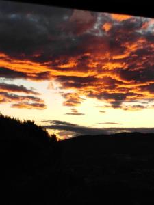 The sunrise or sunset as seen from a panziókat or nearby
