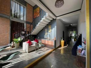 a living room with a couch and a table at Apsara Greenland Boutique Villa & Resort in Siem Reap