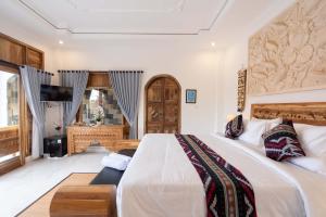 Letto o letti in una camera di Barong Bali Resort Ubud