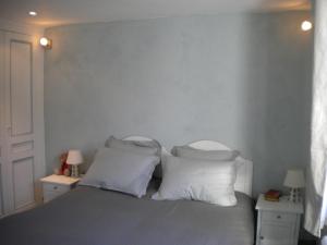 Postel nebo postele na pokoji v ubytování La Petite Fugue