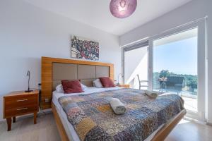 a bedroom with a large bed and a large window at Villa Rozeta in Marčana +37 photos