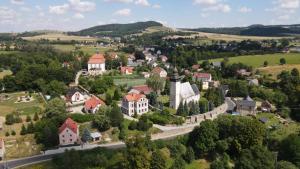 an aerial view of a small town with houses and trees at Pod Wieżą u Kory in Siedlęcin
