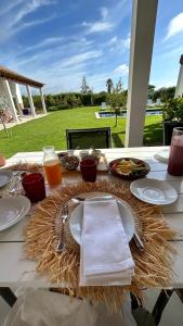 a table with a plate of food on top of it at Casa da Courela in Cavaleiro
