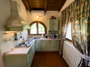 a kitchen with a sink and a counter top at Borgo Santa Lucia Monolocale in Castiglion Fiorentino