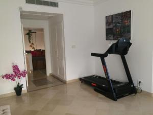 a room with a treadmill and a living room at Villa Gammarth - Suite N°2 in Gammarth