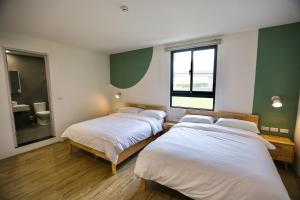 Letto o letti in una camera di 青逸居 桃園中壢民宿 親子包棟 Qing Yi Ju