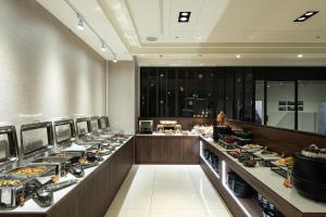 a buffet line with many plates of food at Spring Rhapsody Hotel in Taichung +110 photos