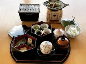 a table with a tray of food on a table at Sunrise Katsuura in Nachikatsuura