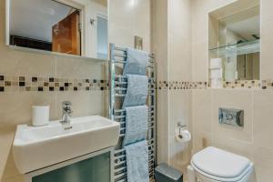 a bathroom with a sink and a toilet at Lovely One Bedroom Flat in Bournemouth