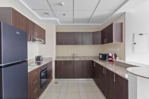 Kuchyň nebo kuchyňský kout v ubytování StoneTree - Bright & Modish 1BR Apartment