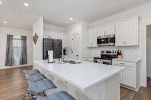 a kitchen with white cabinets and a white counter top at Where wins come true in Baton Rouge