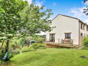 a large white house with a large yard at Pendle Hill Farm - 5* Luxury, Log fire, Parking in Burnley